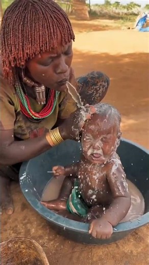 This is how tribal mothers bathe their children ~ #shorts