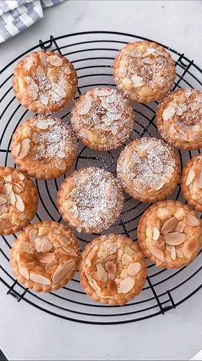 Yukiko Tanzi on Instagram: "Almond croissant tartlets ✨🥐 If you're an almond croissant addict, you'll love these tartlets! Ingredients for the crust (20 mini pies) 330g all purpose flour 130g powdered sugar Pinch of salt 150g cold butter, cubed 1 medium egg 1 egg yolk 1 tsp vanilla bean paste Ingredients for the frangipane filling 80g butter, softened 80g caster sugar 100g almond flour 1 small egg 1/2 tsp vanilla extract 1/4 tsp almond extract 1/8 tsp salt 1/2 cup sliced almonds Powder sugar fo