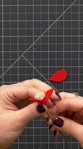 Create an on point poinsettia garland! The whole family will want to join in to make this fun felt garland. Kunin Premium Felt, Blick Armature Wire, a bit of glue, and holiday spirit are all you need for this stunning craft that will make any mantel or table look festive. | Blick Art Materials