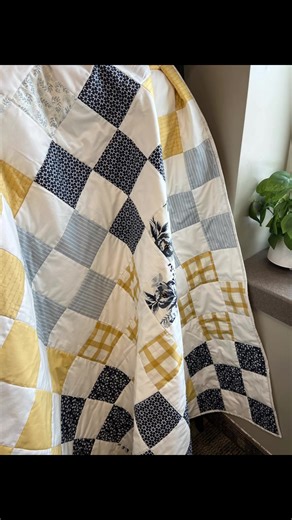 With a soft palette of blues, yellows, and cream, this patchwork is a timeless piece that will hold memories for generations to come. #QuiltTok #TheQuilTeaCorner #handmadehome #ClassicQuilt