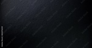 Black rough paper surface, slow moving. Use for background and texture.