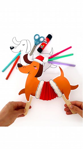 Ocean Child Crafts on Instagram: "Try out this fun dancing Christmas dog craft activity! 🐶🎄🎅🏻 This paper craft has a humorous twist: attach two popsicle sticks to your dog’s backside and watch it dance to some festive Christmas tunes. The kids will have a blast!✨ You only need some basic craft supplies. Visit our blog for easy-to-follow instructions on creating these festive Christmas dogs. Plus, you can use our printable bundle for added convenience—just print, color, and craft! This will s