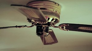 Ceiling fan. Creating air coolness on hot days. Dramatic cinematic atmosphere. Copyspace. Space for titles or text. Suspense triller scene
