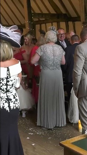 bride and groom walk up the aisle