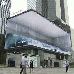 7.2M views · 199K reactions | This art installation on a giant screen in Seoul, South Korea is being described as an “anamorphic illusion”. Some visitors say the virtual waves are so realistic that it looks like the water will overflow   | 10TV - WBNS | Facebook