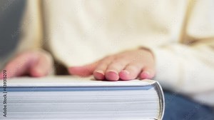 Pages of the white book. Reading literature in the library