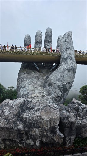 🌉 The Golden Bridge, Vietnam Held by two giant stone hands, this bridge seems to float between earth and sky, a place where architecture meets imagination. ✨ Located in Ba Na Hills, near Da Nang, the Golden Bridge isn’t just a viewpoint… It's a masterpiece designed to make you feel like you’re walking among the clouds. ☁️ Would you dare to cross it? 💛 Plan. Go. Live. #GoldenBridge #BaNaHills #VietnamTravel #Plan2GoTravel #TravelDreams #ExploreAsia #TravelReels #Wanderlust | Plan2Go - Travel & 