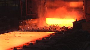 Red hot metal sheets going out of the furnace - Free Stock Video