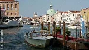 Water taxi at the pier at the canal grande in Venice Italy