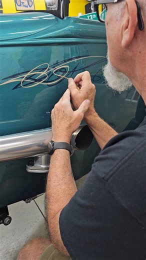 Enjoyed creating some custom pinstriping for the legendary JonandPam Lemasters ! Long distance repeat customers are the best ! I think it took them 3 hours to drive out here to drop off the car. A wonderfully rewarding job. If you follow the teal/aqua body Pinstripes forward they obviously cross across the engine wall and if you continue them across the open area of where the engine is at they meet up on the radiator shell in the wedge shape and they connect across the top and bottom of the radi