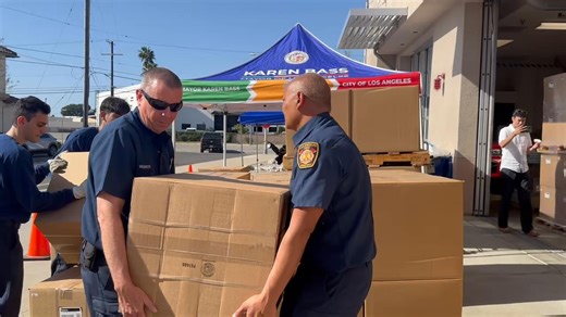 LAFD carry boxes of donated fire safes during a give away event at Fire Station 77 in Sun Valley Los Angeles | Los Angeles Fire Department