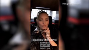 Elsa Hosk shows off her long legs in a black pinstripe dress