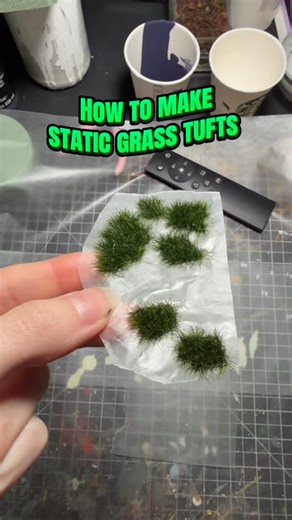 A Lil’ Bazaar on Instagram: "Making little tufts is a bit time consuming but sooo worth it! 🥰💚 How to make static grass tufts: 1) make little organic shapes onto parchment paper with mod podge! 2) use your static grass machine to go over the glue 3) knock off the excess and do a second pass to make the grass fuller 4) let fully dry overnight 5) voila ! #diorama #miniature #dioramacreators #dioramaart #miniatureart"