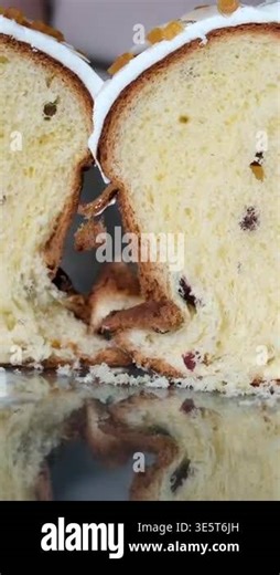 squeeze two halves of Easter bread together to see the springy structure traditional Italian Easter cake shaped like a pigeon. This Easter bread, known as Colomba, is studded Stock Video Footage - Alamy