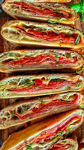 Score big on game day with BlackstoneBetty's Italian Stromboli. Crafted in the new Blackstone E-Series Pizza Oven and Air Fryer, this recipe features provolone, ham, pepperoni, roasted peppers, and fresh basil. #Stromboli #BlackstonePizzaOven #BlackstoneRecipe #OutdoorCooking #GameDay | Blackstone Products