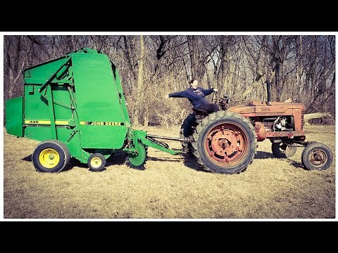 Working on my new 435 john deere round baler with cover edge net wrap
