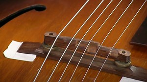 Setting the string spacing at the bridge