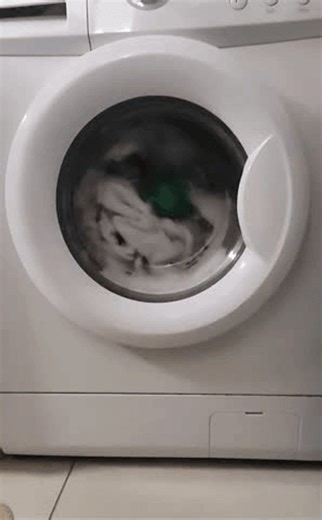 clip-3972426505-close-up-washing-machine-drum-spinning-during-laundry