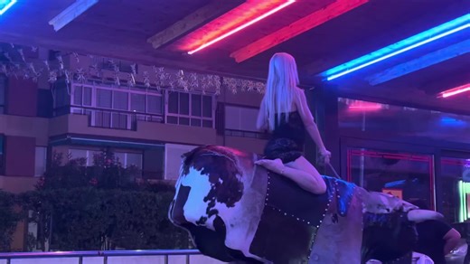 Girl riding mechanical bull #22