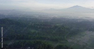aerial drone shoot view of Mount Merapi from Punthuk Setumbu viewpoint in Magelang, Central Java, Indonesia, Borobudur Temple in misty morning, thick fog with mountain view in the background