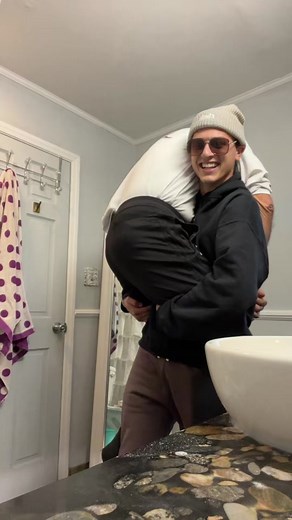 Playful Bathroom Moment Between Friends