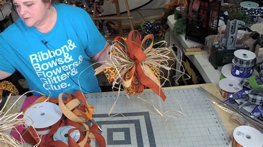 Let's grab some ribbon, raffia and make a bow, Charmers!! How darling is this DIY Fall Raffia bow for your fall wreaths and decor? We are obsessed! | Southern Charm Wreaths