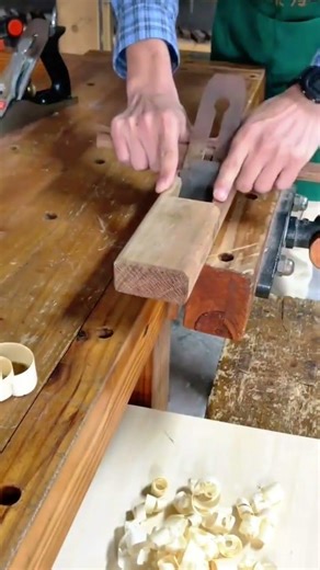 Manual Wood Planer Shaving Thin Layers Off Small Timber Blocks On Wooden Workbench Tops
