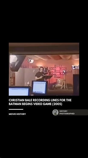 In the 2005 video game adaptation of Batman Begins, Christian Bale reprised his role by recording original dialogue with the same intense, gravelly focus he brought to the film. Behind-the-scenes footage shows Bale in the sound booth delivering lines that emphasize the character's use of fear as a weapon, ensuring the game felt like a true, authentic extension of the movie universe. Credit: Warner Bros. Interactive Entertainment, Electronic Arts | History In Pictures