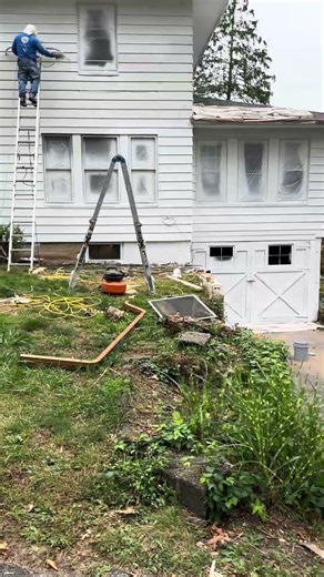 Applying primer on aluminum siding