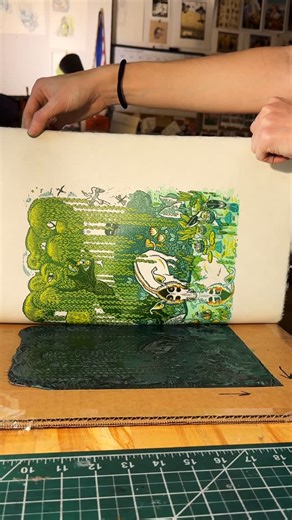 Kathleen Neeley on Instagram: "Printing all four layers of a multi-block color linocut! Block 1: cool layer—flat, light green-blue Block 2: warm layer—yellow with hand painted red details (definitely didn’t forget I was taking a video toward the end of this clip) Block 3: secondary key layer—teal reflection lines in the water, details in the sky Block 4: primary key—main linework in dark green The blocks are registered (aligned with each other) using a cardboard jig, which is taped to the table 