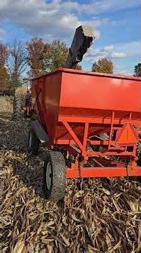 Farmall Super M with single row picker New Idea