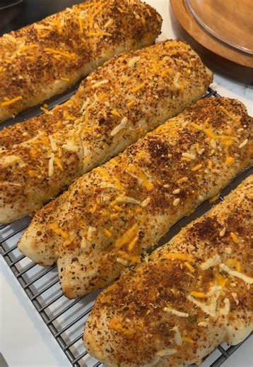 Recipe by @Lacey 🤍 I made mine with her sourdough focaccia! These are INCREDIBLE! Sourdough Italian herb & cheese sandwich rolls 🤍 Soft inside. Cheesy edges. Perfect rise.