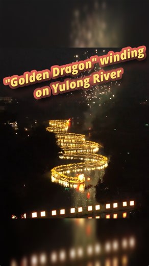 On New Year's Eve, a 1,000-meter-long "golden dragon" consisting of nearly 100 bamboo rafts was seen winding through the waterway of Yulong River, China's Guangxi. #China #Xinhua #NewYear #Dragon #happynewyear #golden #viral | China Xinhua News