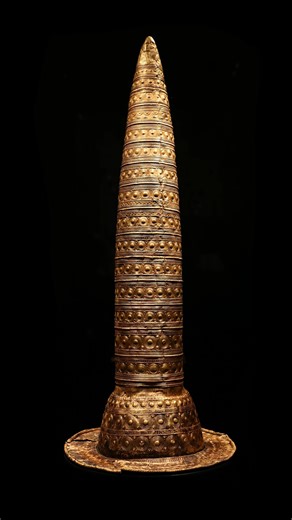 Possibly over 2,800 years old, the Berlin Gold Hat is attributed to the Late Bronze Age of Central Europe, and is believed to have been made in Southern Germany or Switzerland. It was hammered from a single sheet of gold alloy (87.7% gold, 9.8% silver, 0.4% copper, 0.1% tin), and displays an extremely tall, conical form with a flaring brim and is decorated with 21 ornamental sections of repoussé motifs created with at least 17 separate stamps. The hat measures 74.5 cm (29 5/16 in) in height and 