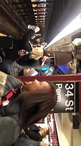 An entire New York subway has been caught on film breaking into a Mariah Carey singalong after one of her Christmas show specials in New York. Credit: @ilibabee | The Daily Buzz