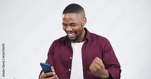 Prize, celebration and black man winning on a phone with giveaway isolated in a studio white background. Wow, winner and young person happy or excited for bonus online from mobile app or internet