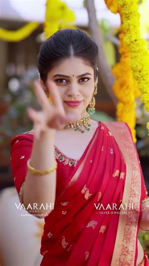 stunning bridal red Kanchi Pattu saree by Vaarahi Silks paired with elegant Vaarahi Silver Jewellery