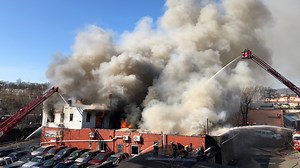 Paterson firefighter OK after falling through roof during five-alarm blaze