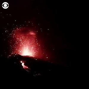 Lava erupted from the Cumbre Vieja volcano on the Spanish island of La Palma on Tuesday. More than 200 buildings were destroyed and 6,000 people evacuated as lava advanced toward the coastline of La Palma amid the eruption. | CBS News