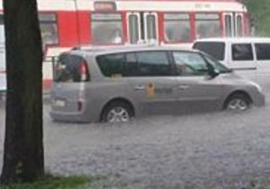 Cars Drive Through Floodwaters After Heavy Rain, Hail in Gdansk