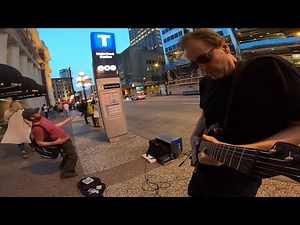 Another brick in the wall -Busker plays greatest guitar solo in history, air guitarist join in!