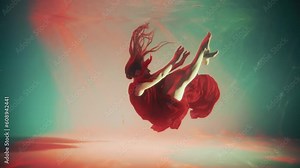 Fantasy mystery woman dancer swims underwater in magic neon green red light. Fairy tale Beauty Girl princess soars floating in dream colorful water. Art dancing waving silk dress. fashion model posing