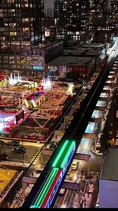 Christmas Train on the Pink Line passing the Jack Frost Christmas outdoor pop-up in the West Loop, Chicago. | Explore Chicago Like a Local