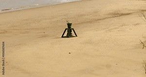 long shot of the tide and time bell at Happisburgh beach in March 2024.