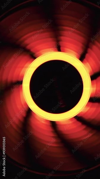 An integral part of a computer, a spinning fan. Close up of cooling system of a modern computer.