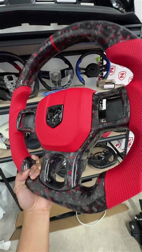This customer went all out and got a Dodge ram 1500 steering wheel to upgrade his full interior. We have forged carbon fiber fully Custom made everything he asked us to do. We have done it for him and we’re also gonna hook them up with a free installation. The Dodge ram 1500 is an amazing car and why would you not want to upgrade the interior with one of these custom steering wheels? You can DM us right now to get started and talked to one of our specialist #dodge #carsoftiktok #dodgeram #ram150