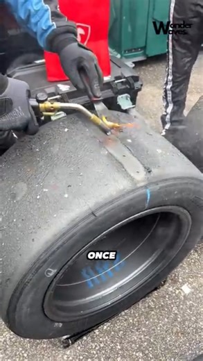 Technicians Scrape Racing Tires After a Race #shorts