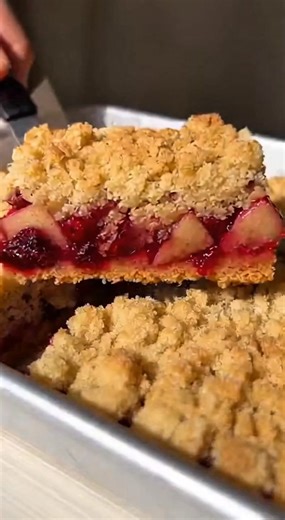 Cranberry-Apple Streusel Bars Ingredients Serves 15 2 small Gala apples, unpeeled and finely chopped (about 2 1/2 cups) 1 1/2 teaspoons grated orange zest 1/2 cup cold unsalted butter (4 ounces), cubed 2 large egg whites 1 1/2 cups fresh or frozen cranberries 3 tablespoons cornstarch 1 1/2 cups all-purpose flour 1 1/2 cups whole-wheat flour 1 teaspoon baking powder 1 tablespoon vanilla extract 1/4 teaspoon ground nutmeg 2 tablespoons orange juice 1/2 cup sugar 3/4 teaspoon salt #CranberryAppleSt
