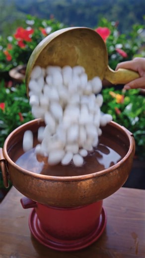 Art Post Unity on Instagram: "This artist brings silk to life, starting from the source: silkworm cocoons. 🐛🧵 She carefully spins the silk by hand, weaves it into fabric, and dyes it with rich natural colors. 🌿🎨 Her true artistry shines in the embroidery. With quiet precision, she stitches lifelike images, like a playful cat so soft it seems real. Every piece is made with patience, tradition, and heart. From cocoon to creation, her work is a tribute to handmade be