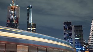 clip-1020464191-time-lapse-cityscape-night-passing-monorail-train